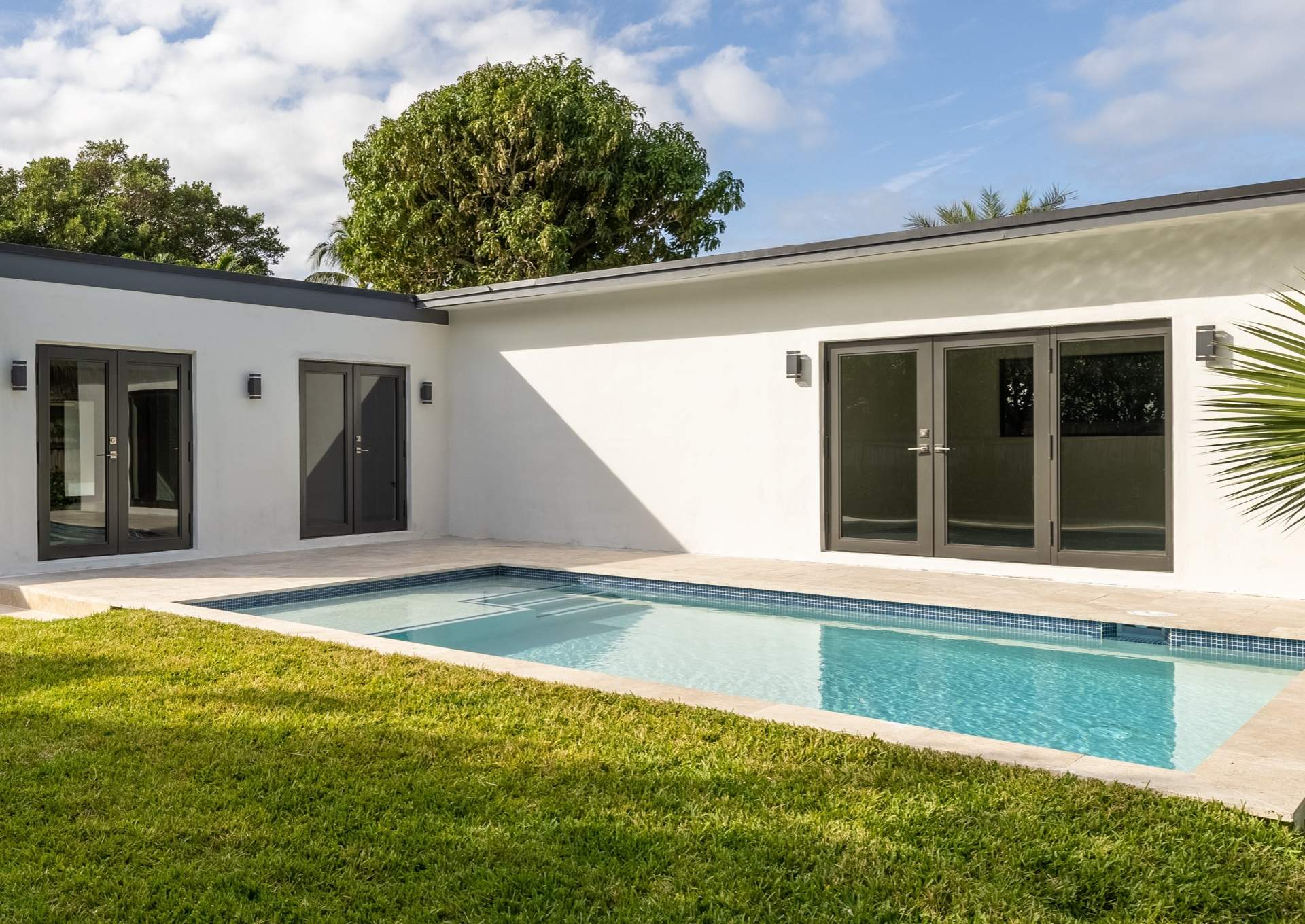modern residential backyard with impact doors