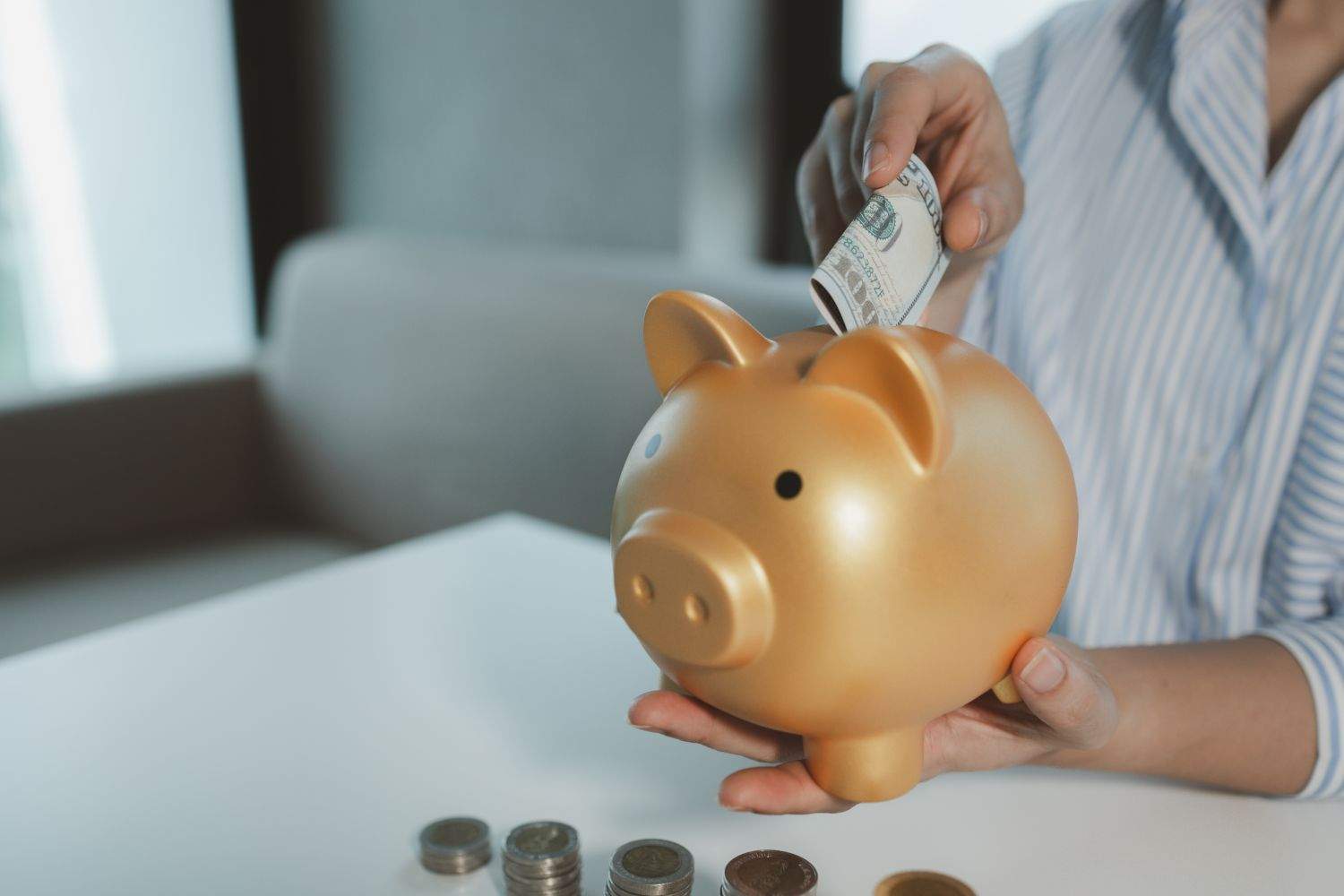 putting money into a piggy bank
