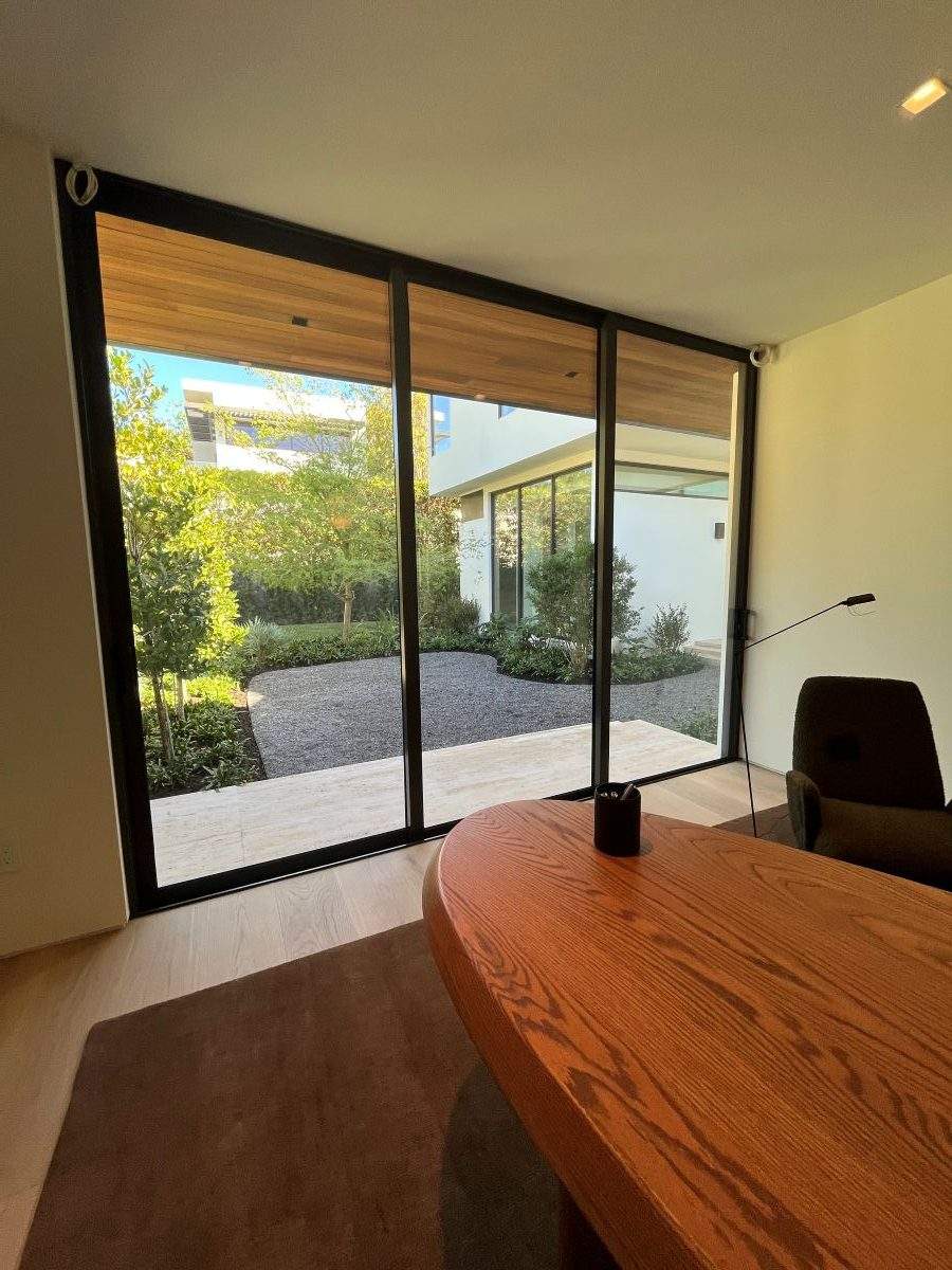 modern interior workspace with impact glass door